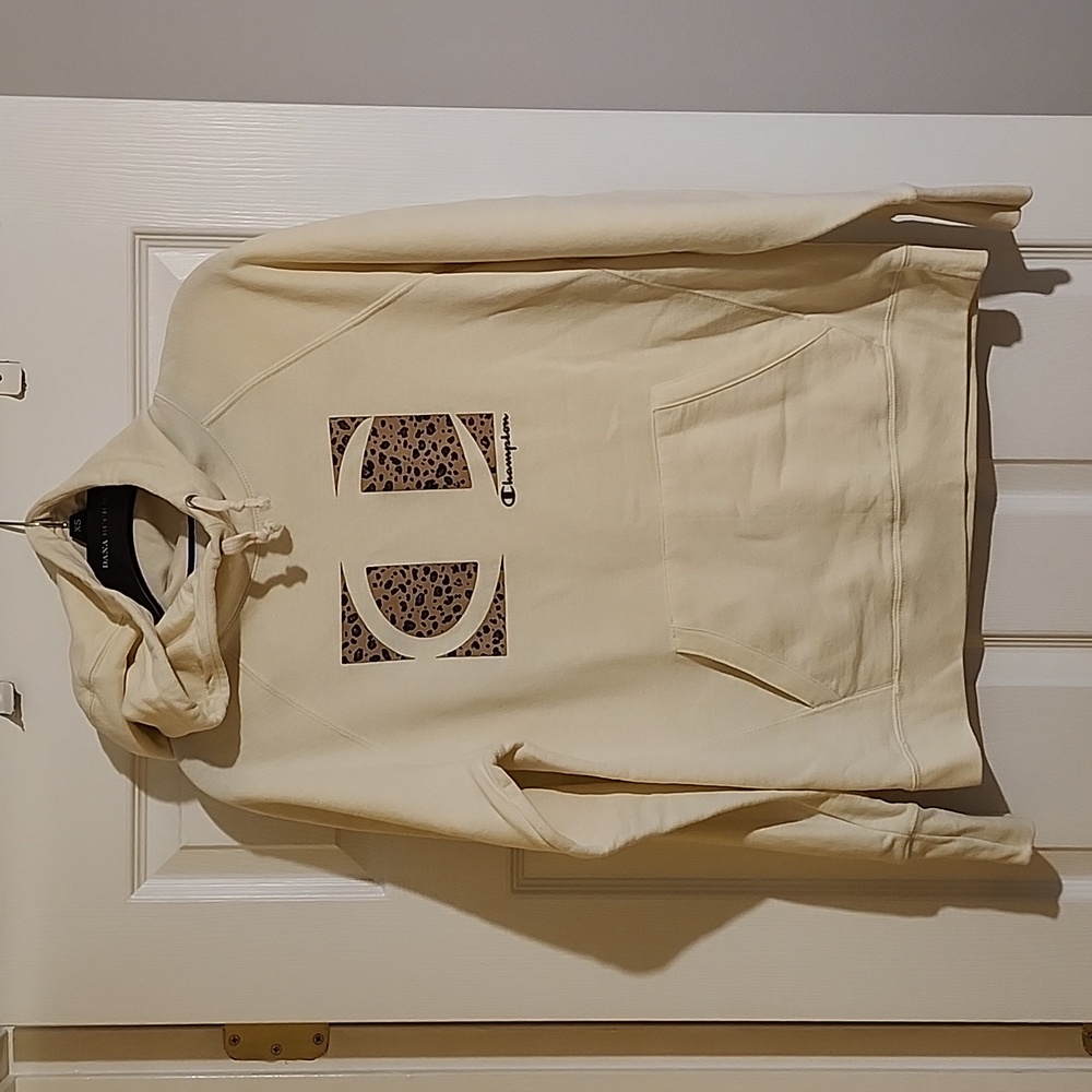 Champion sweatshirt hoodie, Medium.  Leopard print detail. White/cream color.